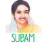 A colorful illustrated portrait of a smiling South Indian woman wearing jasmine flowers in her hair, a yellow saree, and gold jewelry, with the word ‘SUBAM’ written below in green stylized text.